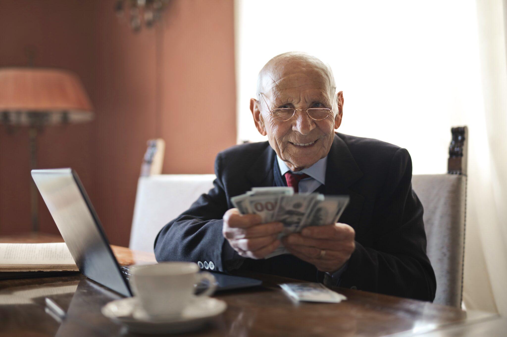 a Financial Manager holding money in his hands