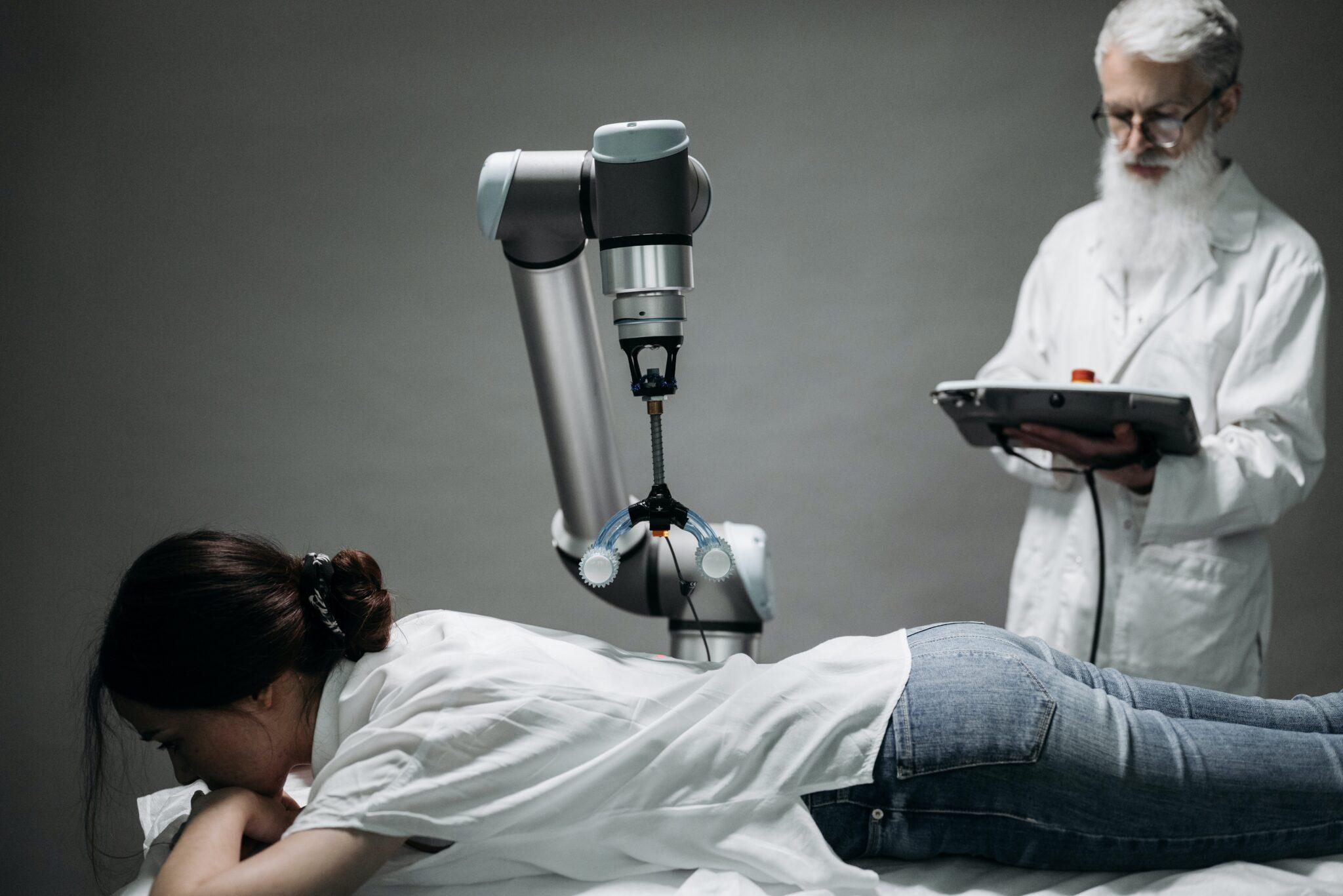 a Physical Robot helping a doctor in diagnosing a lying female patient