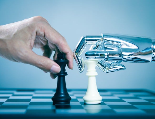 A human and a Robot playing chess showcases a showdown between human professionals and AI
